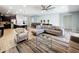 Open concept living room featuring neutral colors, ceiling fan, and tile flooring at 1614 Lima Ave, Kissimmee, FL 34747