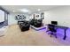 Entertainment area featuring a projector screen, recliners, foosball table, and desk at 1614 Lima Ave, Kissimmee, FL 34747