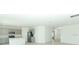 Open concept kitchen with stainless steel appliances and spacious layout connecting to living area at 165 Citrine Loop, Kissimmee, FL 34758