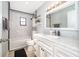 Bathroom with marble countertop vanity, tub with shower and neutral paint at 1730 Carolyn Ct, St Cloud, FL 34769