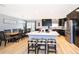 Bright kitchen features black cabinets, stainless steel appliances, and eat-in dining area at 1730 Carolyn Ct, St Cloud, FL 34769