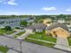 Aerial view of home in a residential neighborhood with mature trees and well-kept lawns at 2060 Patriot Way, St Cloud, FL 34769