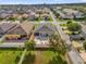 Aerial view of home with backyard pool, pergola, and spacious paved patio at 2060 Patriot Way, St Cloud, FL 34769