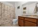 Bathroom featuring a shower and tub combo and neutral-colored vanity and fixtures at 2060 Patriot Way, St Cloud, FL 34769