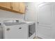 Laundry room featuring a front-load washer and dryer at 2060 Patriot Way, St Cloud, FL 34769