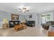 Spacious living room featuring tile flooring, comfortable seating, and ample natural light at 2060 Patriot Way, St Cloud, FL 34769