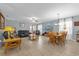 Open-concept living space combining living and dining areas with tile flooring and lots of natural light at 2060 Patriot Way, St Cloud, FL 34769