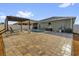 Backyard pool with paved patio, pergola, and lounge chairs, ideal for summer relaxation at 2060 Patriot Way, St Cloud, FL 34769