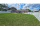 Large fenced backyard featuring swimming pool and screened patio at 215 Grovepark Dr, Davenport, FL 33837