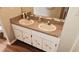 Bathroom featuring double sinks, cabinet storage, and a large mirror at 215 Grovepark Dr, Davenport, FL 33837