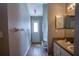 Bathroom featuring double sinks, granite counters, and neutral color palette at 215 Grovepark Dr, Davenport, FL 33837