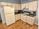 Functional kitchen with ample cabinet space, appliances, and eat-in dining area at 215 Grovepark Dr, Davenport, FL 33837