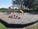 Community playground featuring several play structures at 215 Grovepark Dr, Davenport, FL 33837