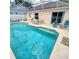 Sparkling pool with screened enclosure and outdoor seating area at 215 Grovepark Dr, Davenport, FL 33837