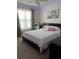 Charming bedroom featuring natural light, a desk area, and a stylish decor at 2203 San Vittorino Cir # 103, Kissimmee, FL 34741