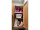 Kitchen cabinet showcasing storage space with various food items and quirky decorations at 2203 San Vittorino Cir # 103, Kissimmee, FL 34741