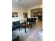 Inviting living room with modern furniture, dining area, and a view into the kitchen at 2203 San Vittorino Cir # 103, Kissimmee, FL 34741