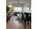 Inviting living space with a contemporary sofa, large window, and modern dining set at 2203 San Vittorino Cir # 103, Kissimmee, FL 34741