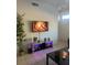 Stylish living area with a modern entertainment unit, ambient lighting, and tiled floors at 2203 San Vittorino Cir # 103, Kissimmee, FL 34741