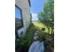 Serene backyard view featuring a scenic pond, lush greenery, and well-maintained landscaping at 2289 Seven Oaks Dr, St Cloud, FL 34772