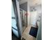 Bathroom with tiled floors, enclosed shower, vanity with dual sinks, and decorative wall art at 2289 Seven Oaks Dr, St Cloud, FL 34772