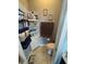 Cozy half-bath with tiled floors, vanity, and decorative towels at 2289 Seven Oaks Dr, St Cloud, FL 34772
