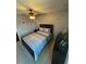 Comfortable bedroom features a ceiling fan and neutral color palette at 2289 Seven Oaks Dr, St Cloud, FL 34772