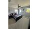 Bedroom featuring neutral paint, a ceiling fan and natural light from two windows at 2289 Seven Oaks Dr, St Cloud, FL 34772