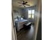 Comfortable bedroom with lake view, ceiling fan, and neutral paint scheme at 2289 Seven Oaks Dr, St Cloud, FL 34772