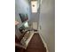 Bright entryway with wooden stairs, natural light and art piece at 2289 Seven Oaks Dr, St Cloud, FL 34772