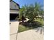 Two story home with garage and manicured landscaping in the front yard at 2289 Seven Oaks Dr, St Cloud, FL 34772