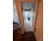 View of a hallway leading to another room, showcasing the home's interior layout and design at 2289 Seven Oaks Dr, St Cloud, FL 34772