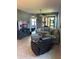 Open living room with neutral tones, plush seating, and views to the lanai at 2289 Seven Oaks Dr, St Cloud, FL 34772