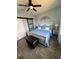 Charming main bedroom features a ceiling fan, barn door, and cool color palette at 2289 Seven Oaks Dr, St Cloud, FL 34772