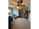 Bright and open office space with a ceiling fan and natural light at 2289 Seven Oaks Dr, St Cloud, FL 34772