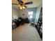 Bright office features a large window, desk, bookshelf, and a comfortable chair at 2289 Seven Oaks Dr, St Cloud, FL 34772