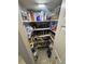 Walk-in pantry with fully stocked shelves and ample storage space at 2289 Seven Oaks Dr, St Cloud, FL 34772