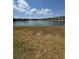 Expansive view of the serene pond with a fountain, providing a peaceful backdrop to the community at 2289 Seven Oaks Dr, St Cloud, FL 34772