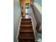Hardwood staircase leading to a bright and open living space at 2289 Seven Oaks Dr, St Cloud, FL 34772