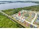 Aerial view of a neighborhood showcasing a home near a lake, pond, and canal at 233 E Cattail, Lake Alfred, FL 33850