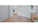 A cozy bedroom features neutral tones, soft carpet, and ample natural light at 233 E Cattail, Lake Alfred, FL 33850