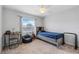 Bright bedroom featuring a ceiling fan, window with blinds, and neutral decor at 233 E Cattail, Lake Alfred, FL 33850