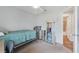 Bedroom featuring neutral walls, carpeted floors, and view of the ensuite bathroom at 233 E Cattail, Lake Alfred, FL 33850
