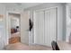 Spacious bedroom with carpeted floors, closet, and a doorway leading to another room at 233 E Cattail, Lake Alfred, FL 33850