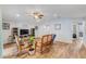 Spacious living room with vaulted ceiling, wood flooring, and neutral paint at 233 E Cattail, Lake Alfred, FL 33850
