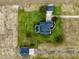 Aerial view of estate featuring home, pool, detached garage and barn on acreage at 2350 Bradbury Rd, Haines City, FL 33844