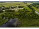 Expansive aerial view of a marshy area and lake, surrounded by trees and green land at 2350 Bradbury Rd, Haines City, FL 33844