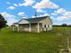 Exterior shot of a barn structure with a weathervane on top and a well-maintained green lawn at 2350 Bradbury Rd, Haines City, FL 33844