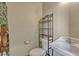 Barn bathroom, featuring a toilet, shelving, and a white basin sink with faucet at 2350 Bradbury Rd, Haines City, FL 33844