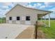 A horse barn exterior with three stalls and a covered area with lighting and a concrete pad at 2350 Bradbury Rd, Haines City, FL 33844